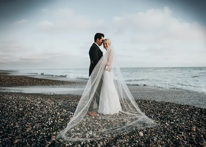 picture of a new bride and groom on a beach